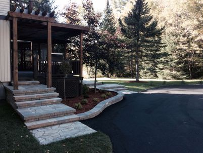 A house with a porch and stairs leading up to it