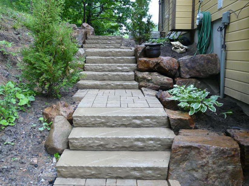 A set of stone stairs leading up to a house