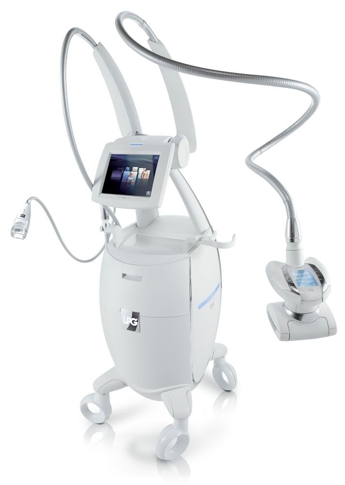 White medical device with a touchscreen and treatment applicators, possibly for body contouring.