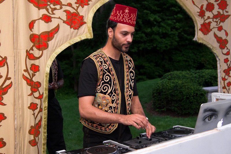 Band and DJs image showing an Arabian style DJ in costume