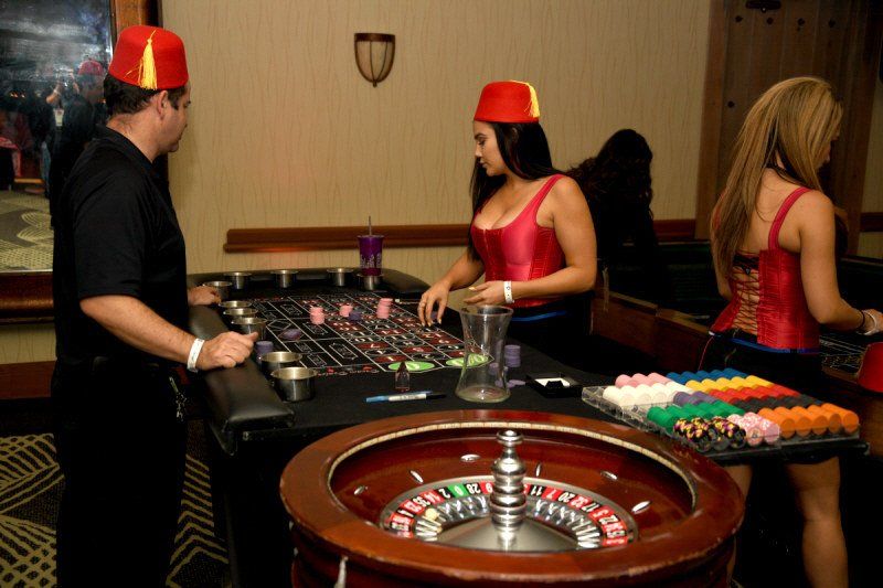 Interactive entertainment image showing Casino setup with servers and staff in costume