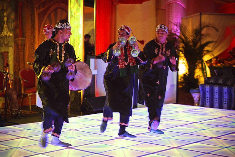 Band and DJs image showing dancing Gnawa musicians