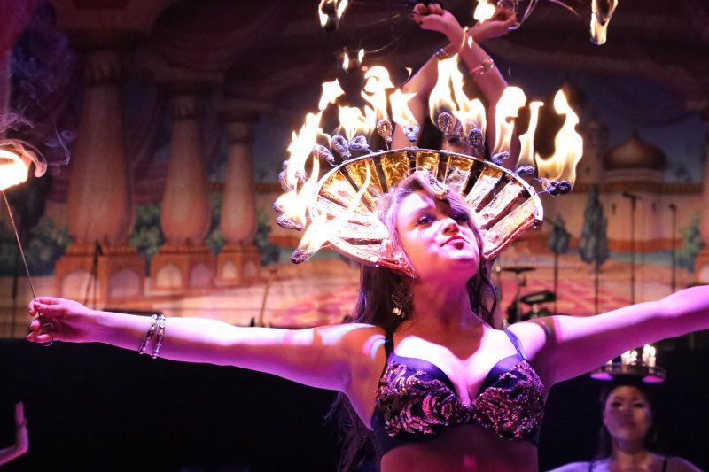 Specialty acts image showing stage show for fire entertainment with woman and fire head dress