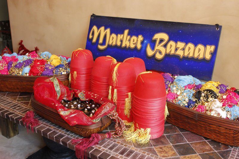 Activity and Lounge areas image showing table with Moroccan party favors including hats, and colorful items
