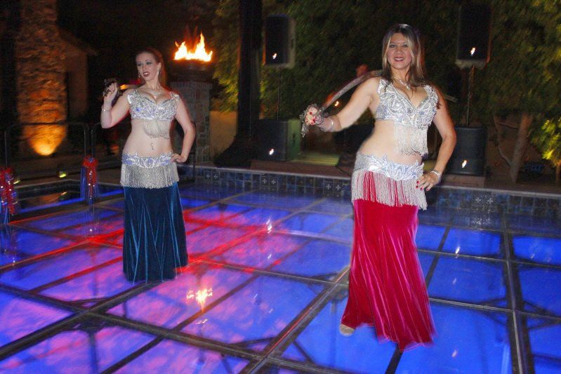 Carpet and dance floors image showing belly dancers performing on plexiglass dance floor installed over a pool