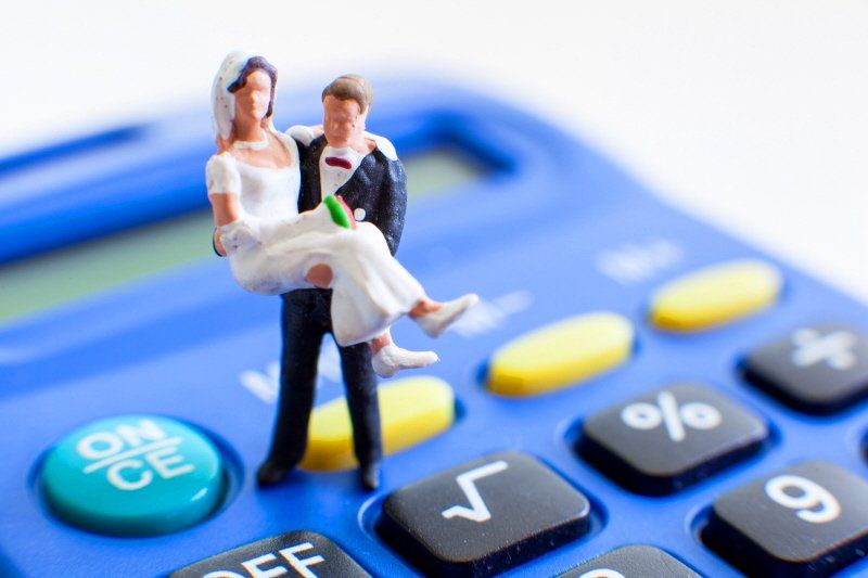 Groom carrying the bride on a calculator
