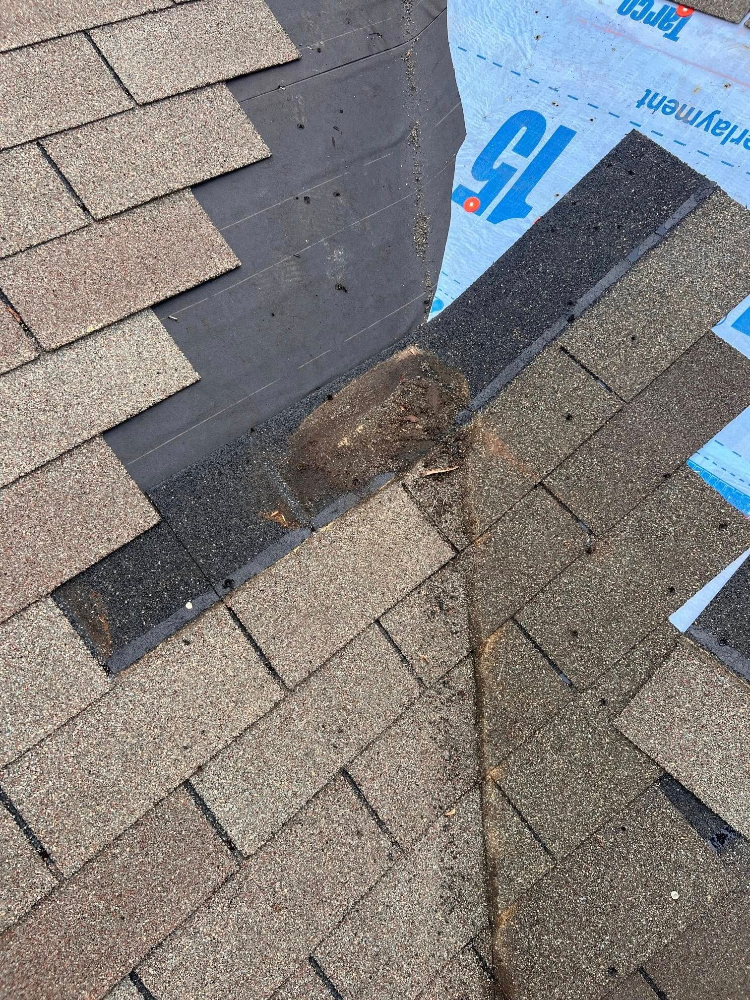 A close up of a roof with shingles on it.