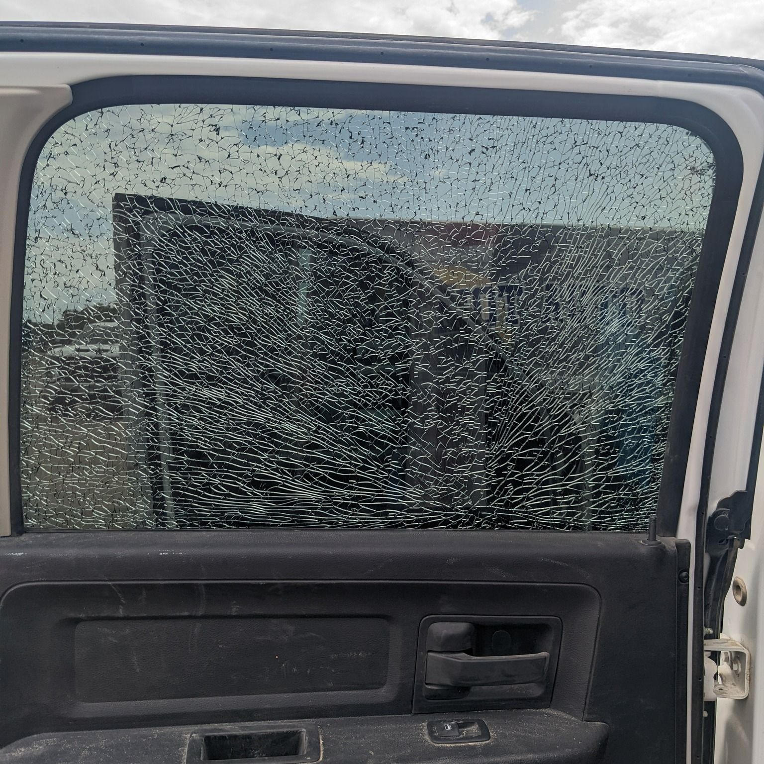 The inside of a car with a broken window