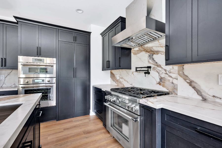 Kitchen with beautiful marble backsplash and stainless steel appliances