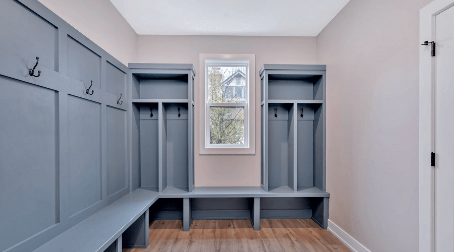Mud room with coat hooks and built in closets