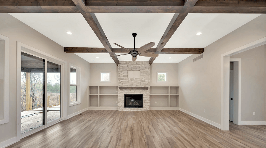 Main room with fireplace and open beam ceiling