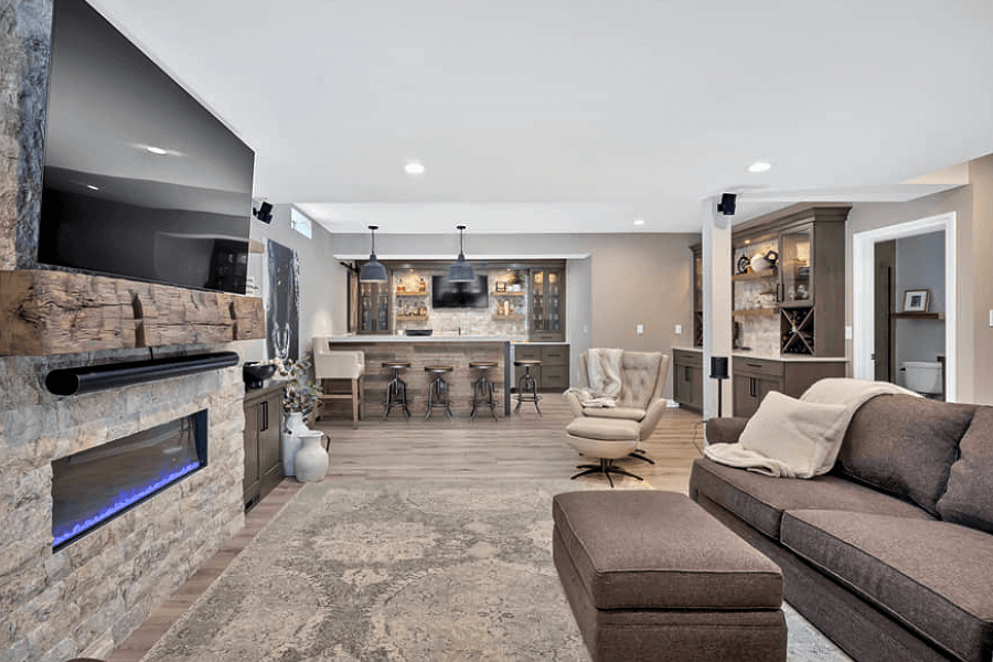 Finished basement with kitchenette and fireplace