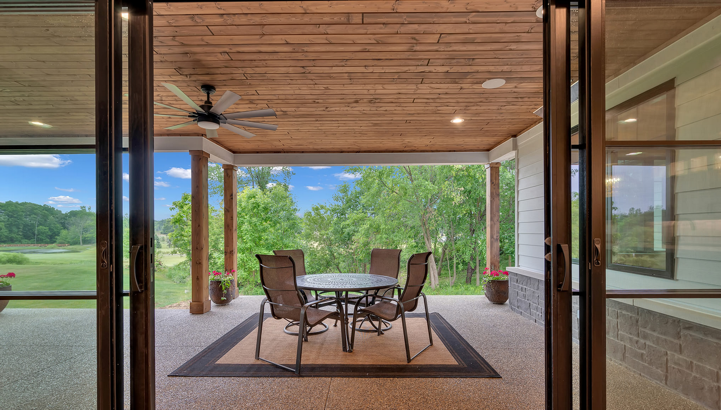 Outdoor porch with table and chairs