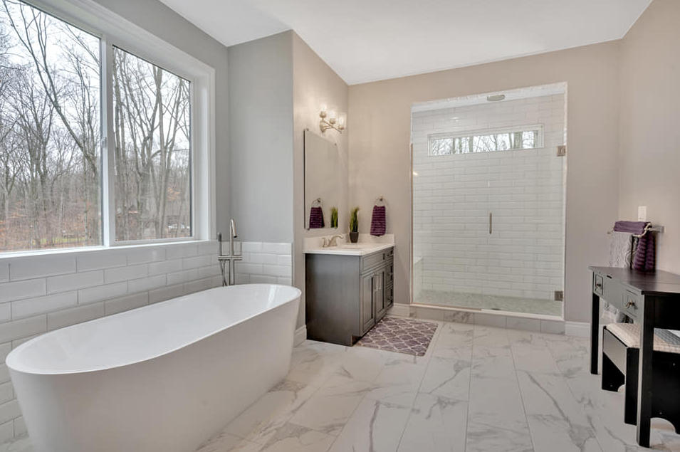 Elegant bathroom with modern bathtub and marble flooring