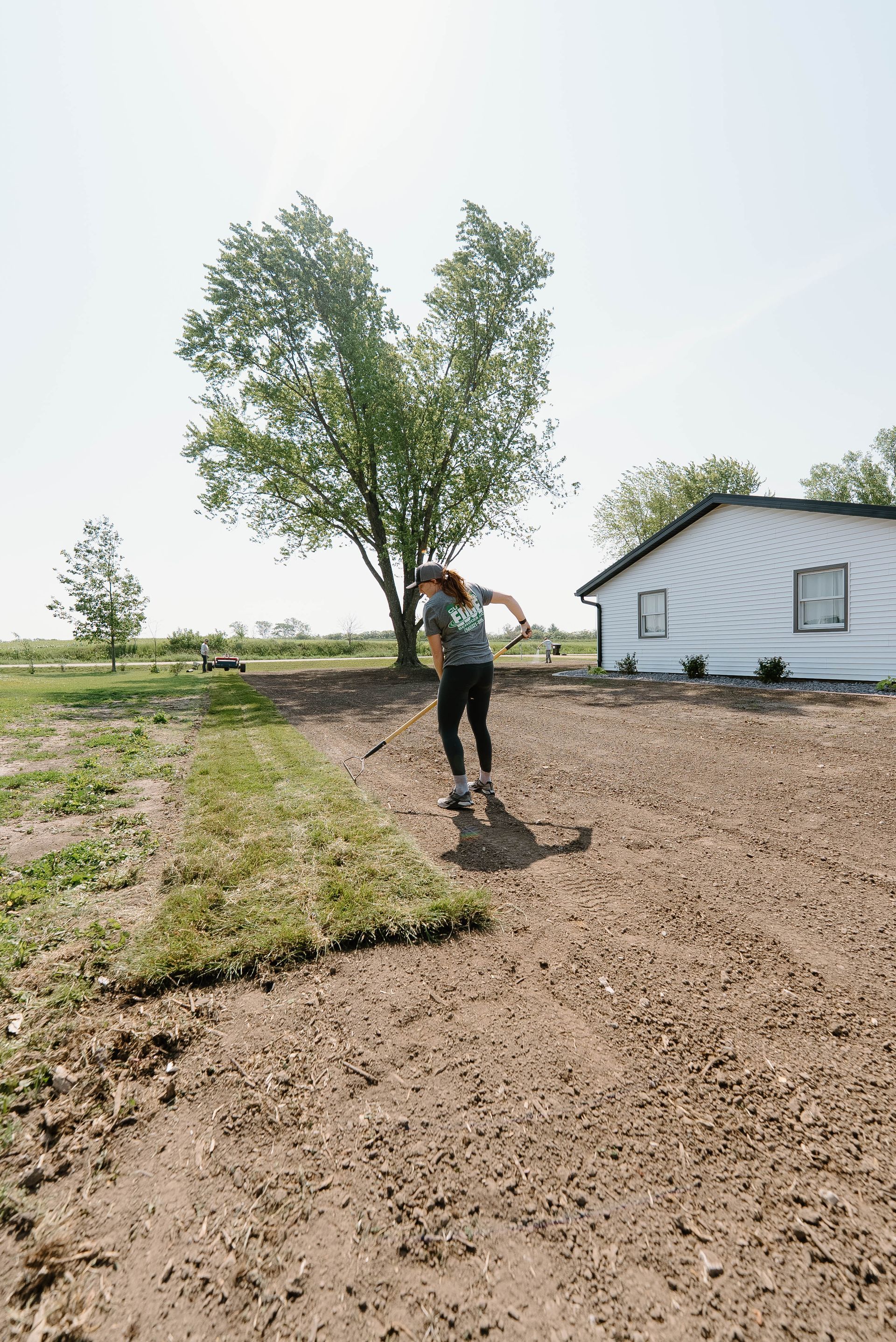 Woman working on new sod