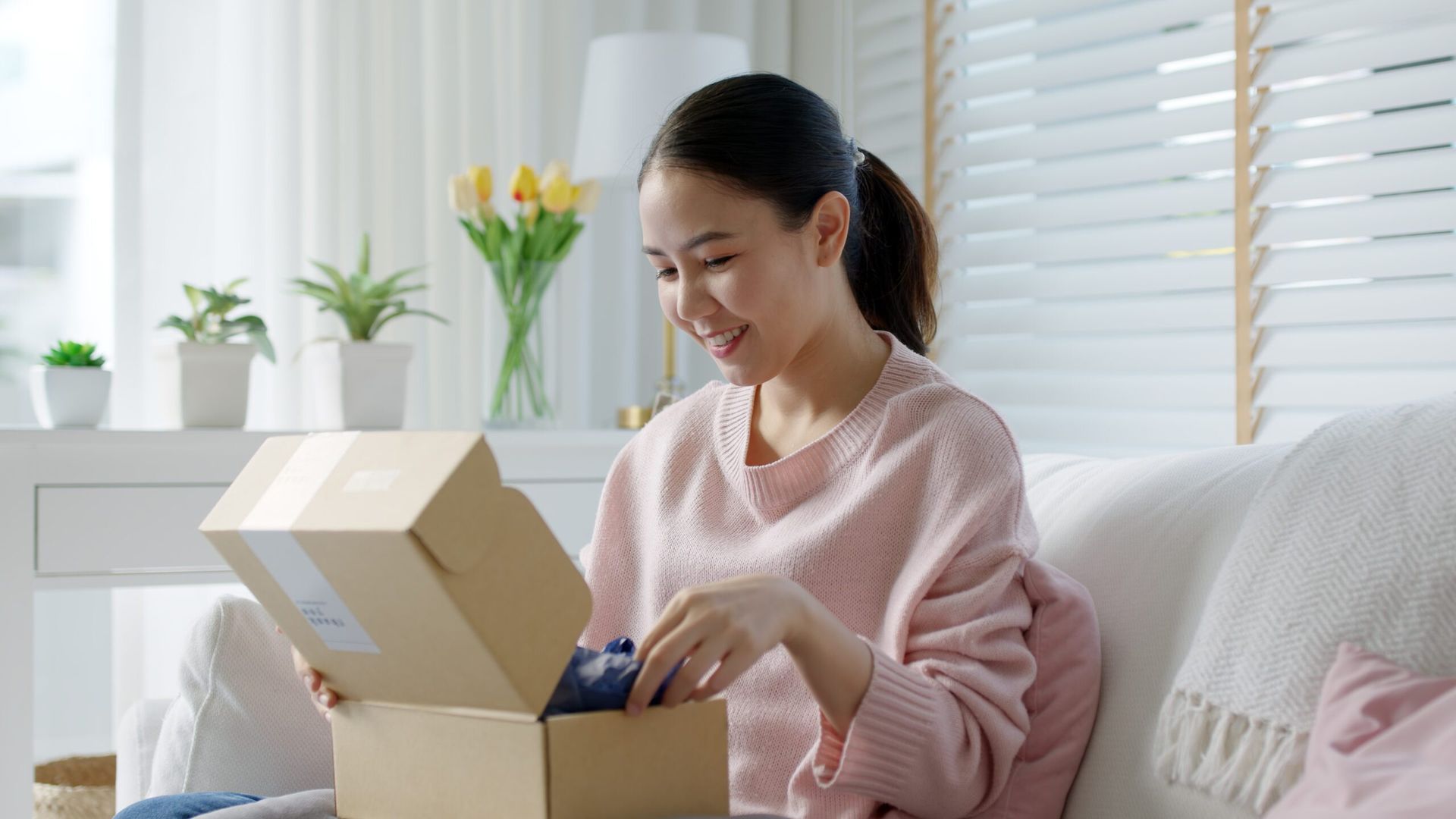 Woman opening a box of natural supplements and test kits for naturally treating depression