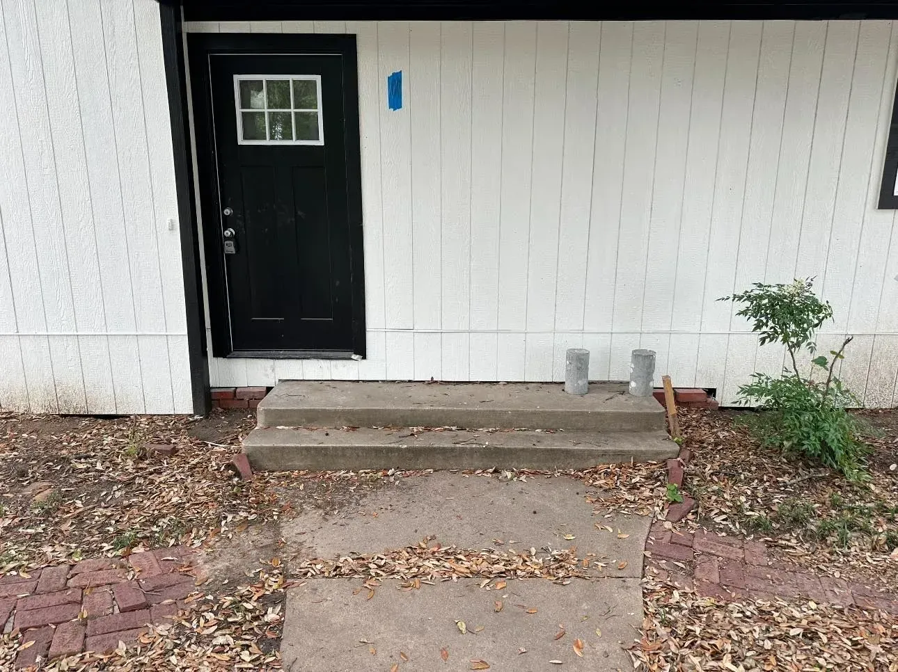 The front door of a house with the number 1 on it