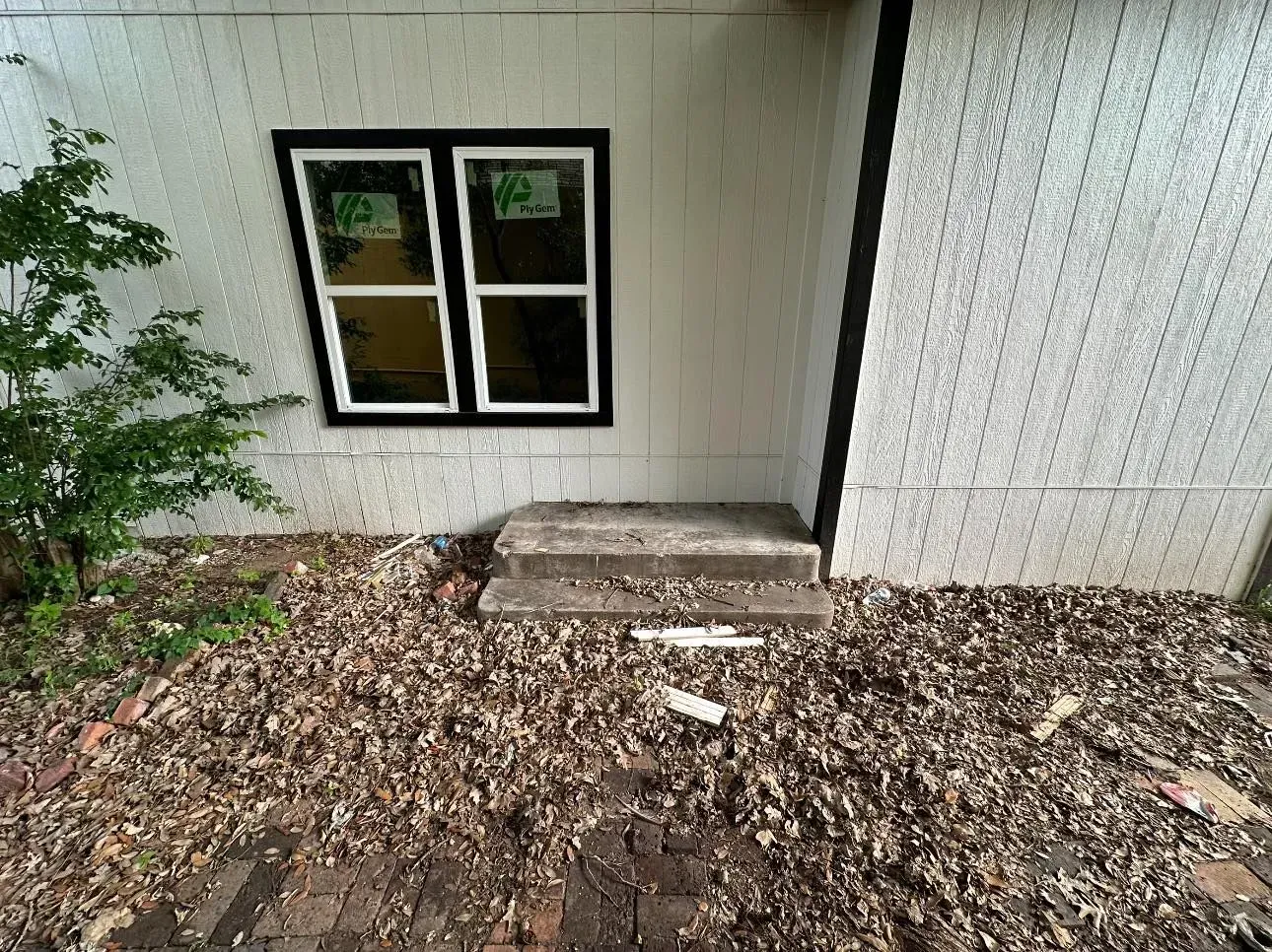 There is a window on the side of a building.