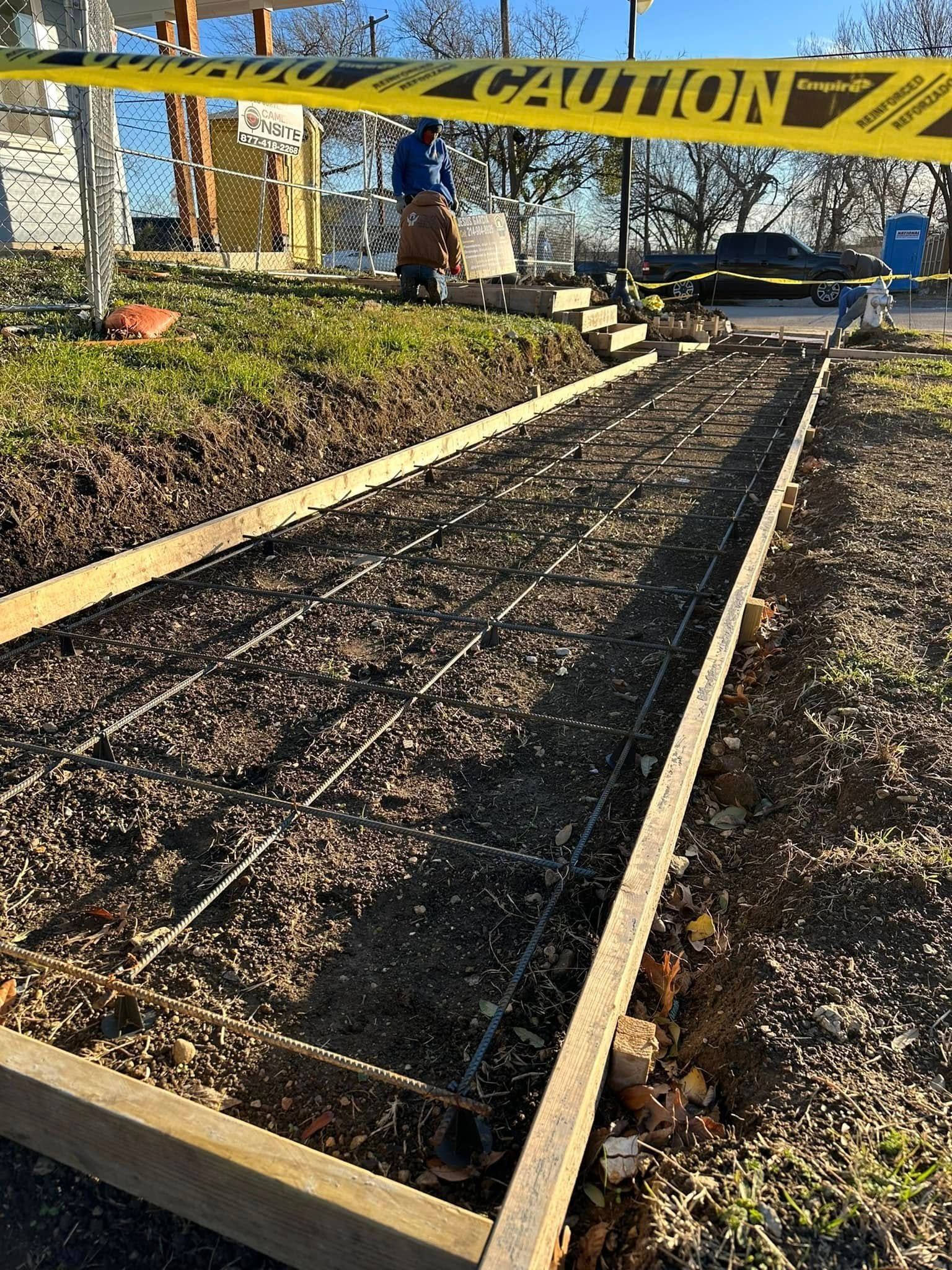 A construction site with a yellow caution tape around it.