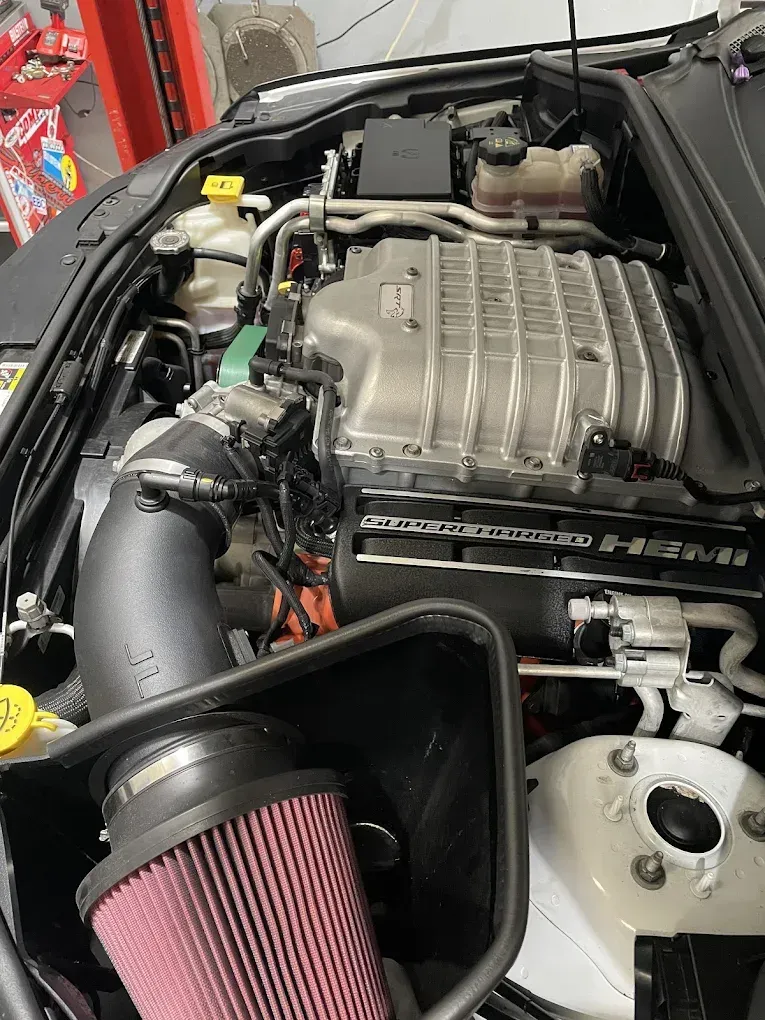 A Person is Charging a Car Battery With a Jump Starter — Chris Bale Automotive in Toronto, NSW