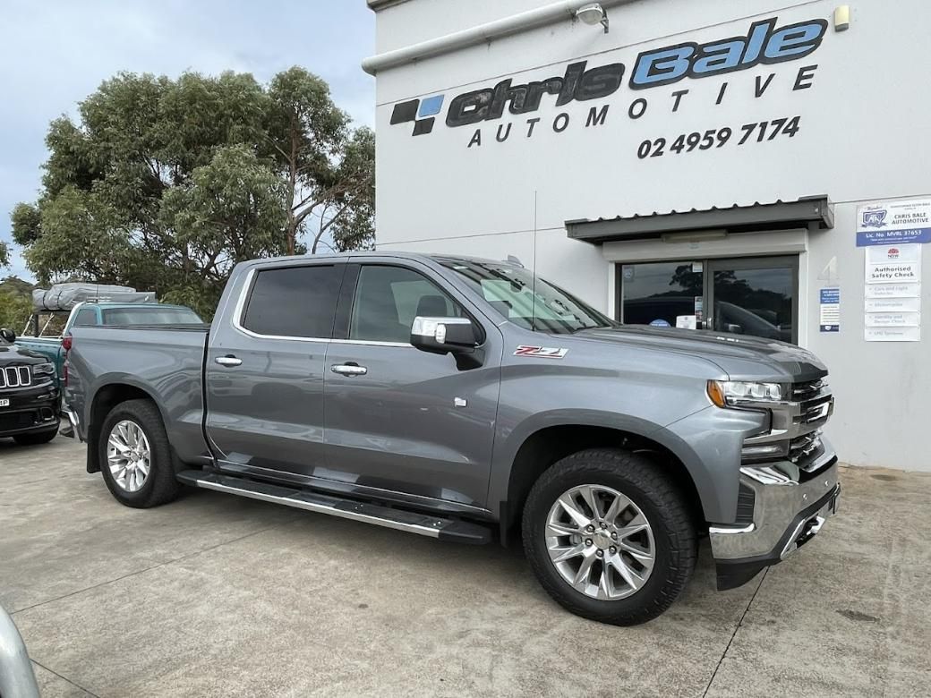A Gray Truck Is Parked in Front of A Car Dealership — Chris Bale Automotive in Toronto, NSW