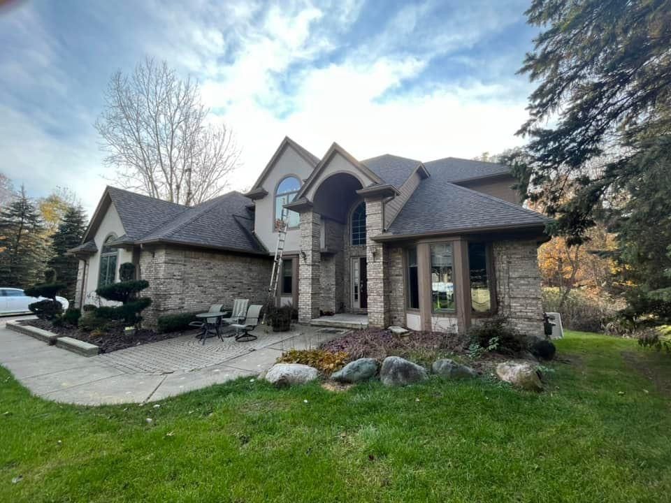 A large house with a large lawn in front of it.