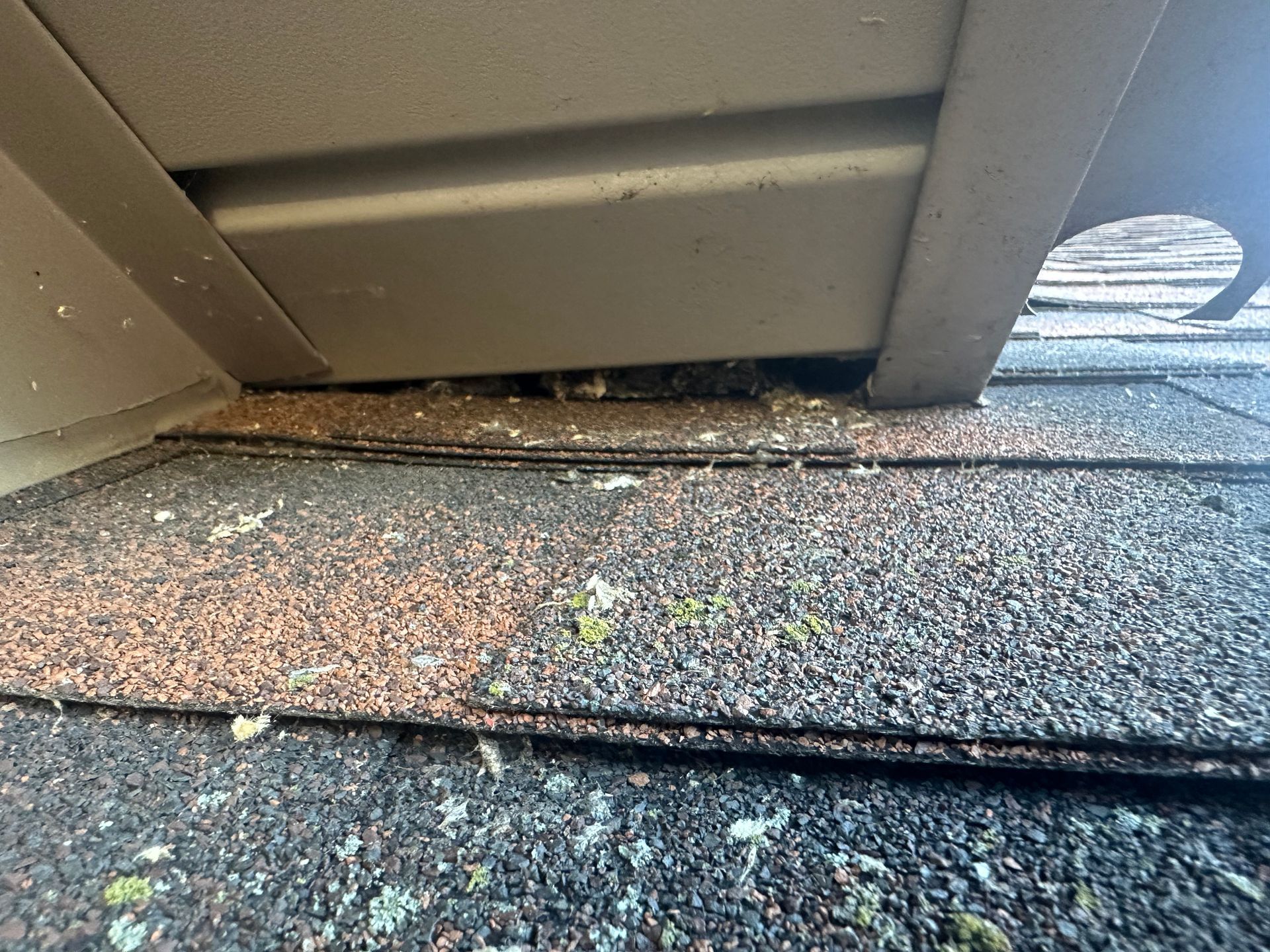 A close up of a roof with a hole in it.