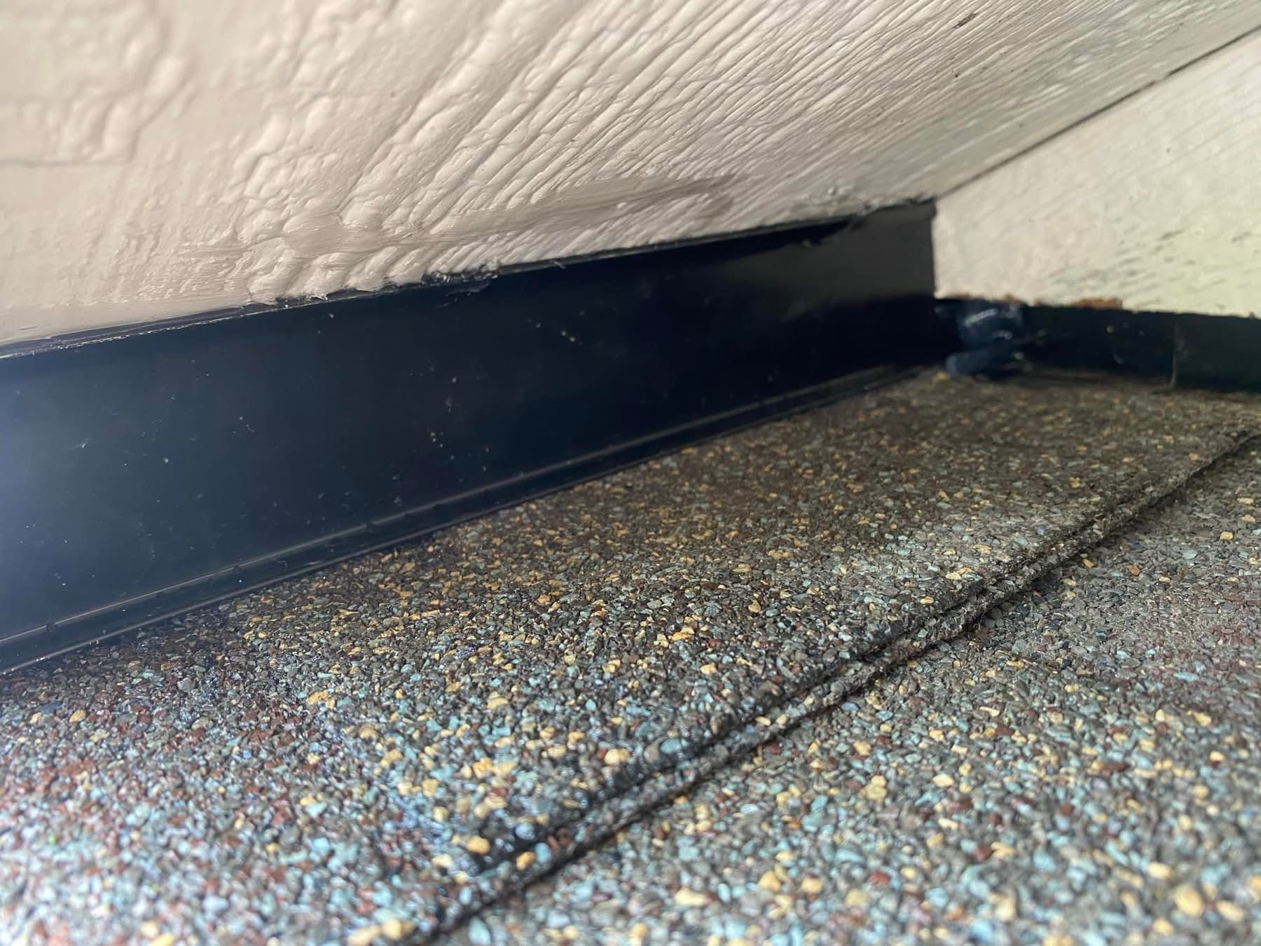 A close up of a roof with a black trim.