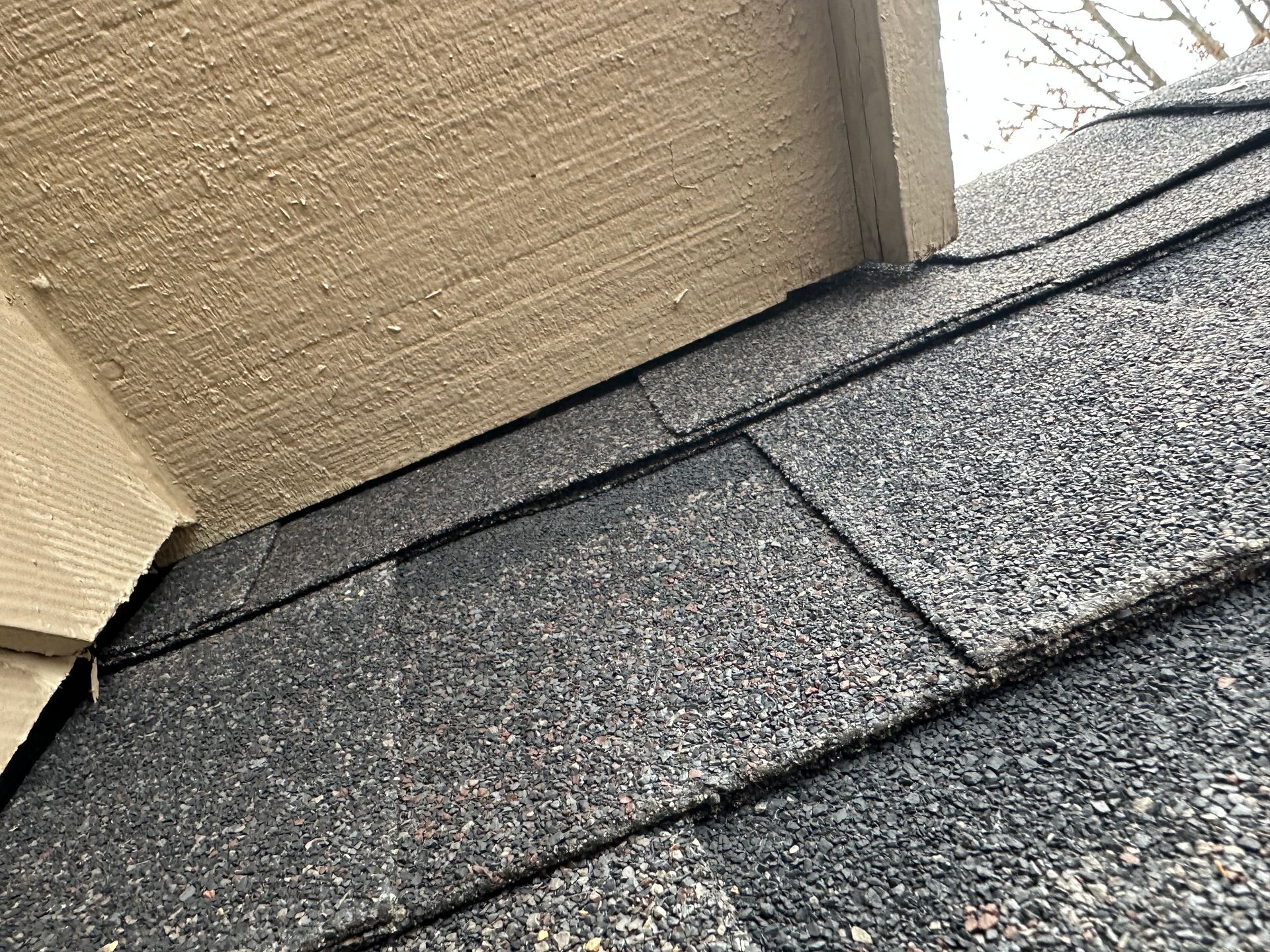 A close up of a roof with shingles on it.