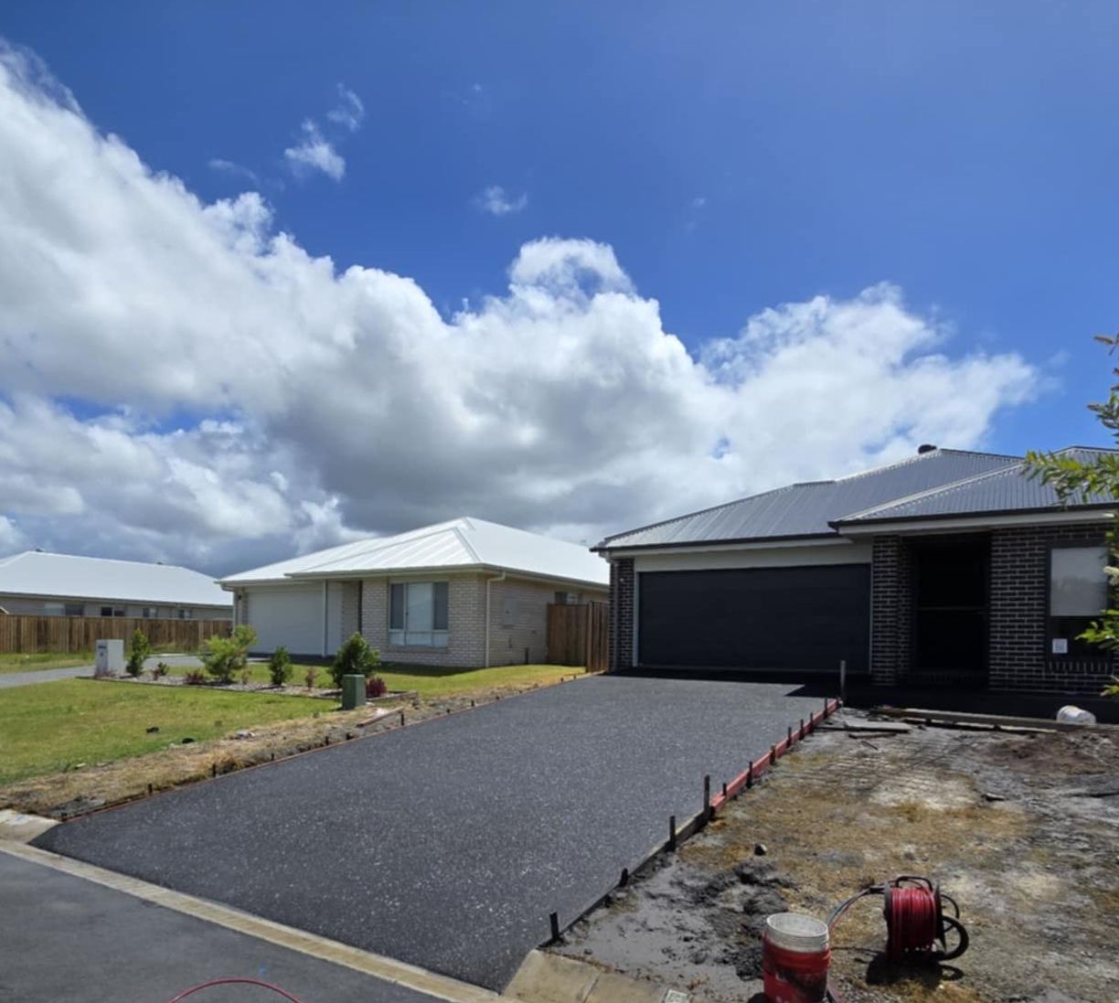 A Concrete Road Is Being Built In A Field — C & A Concreting In Craignish, QLD