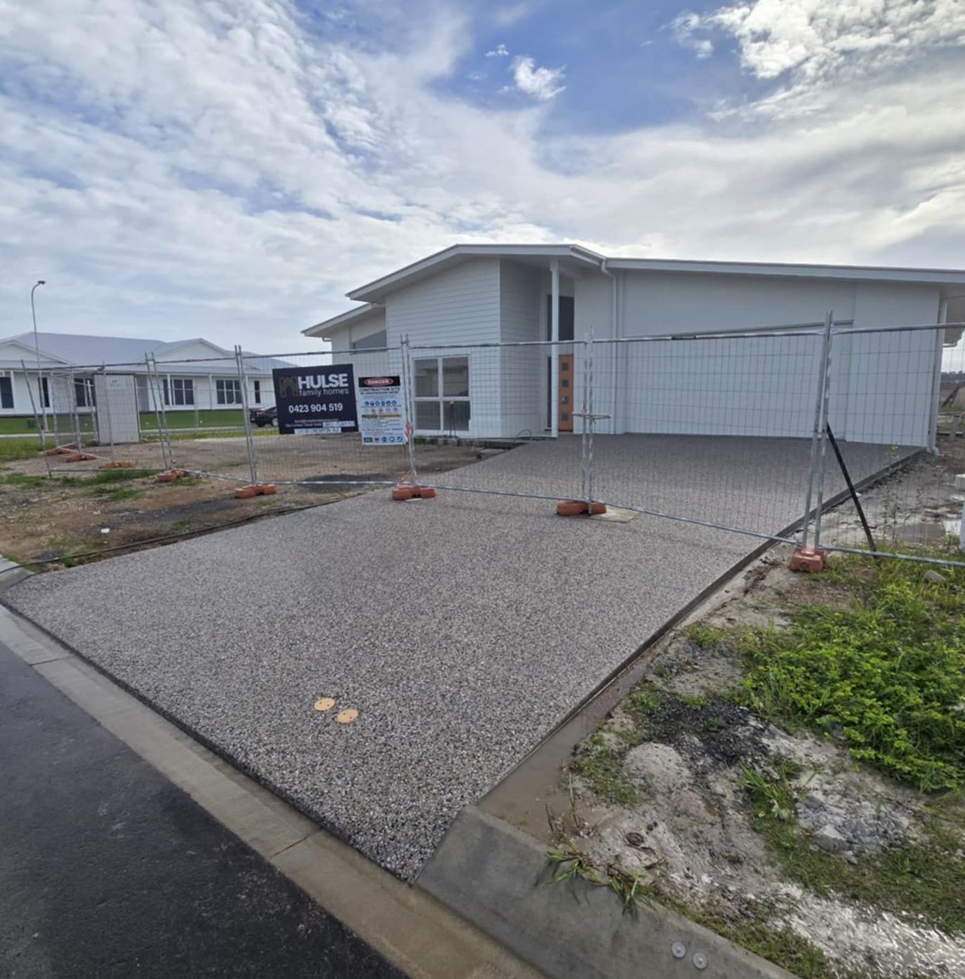 A Concrete Patio Is Being Built In The Backyard Of A House — C & A Concreting In Craignish, QLD