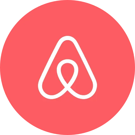 Een rode cirkel met een witte a erop