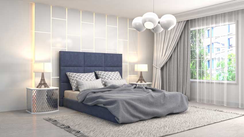 camera con letto blu e illuminazione di design