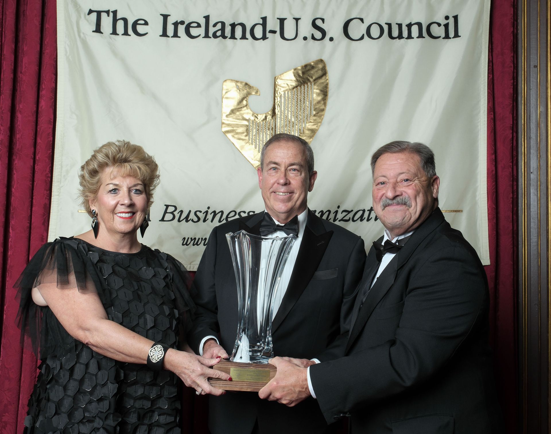 two Ireland-U.S. council members with award recipient Dermot Desmond