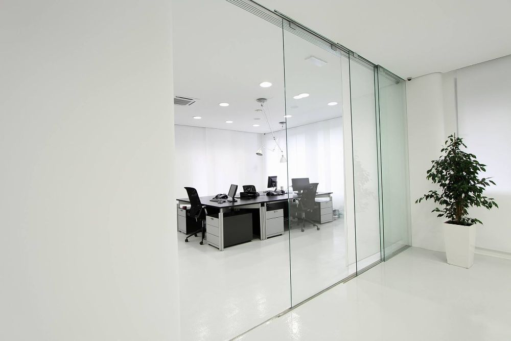 A Modern Office with Sliding Glass Doors and Cubicles — North Queensland Glass & Glazing In Airlie Beach, QLD
