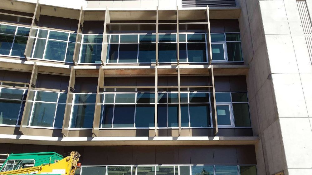 A Large Building with A Lot of Windows — North Queensland Glass & Glazing In Cannonvale, QLD