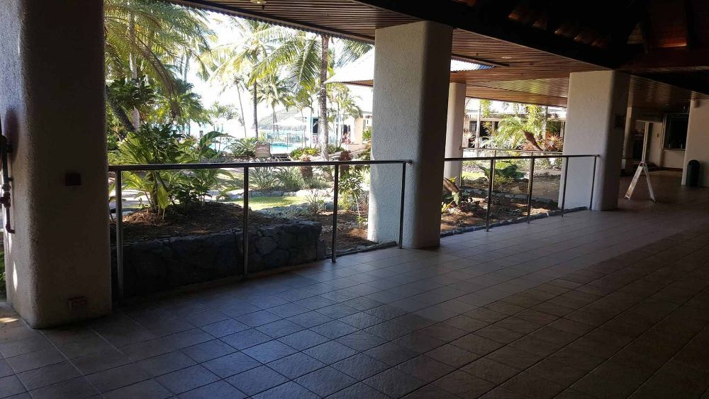 A Balcony with A View of A Park and Trees — North Queensland Glass & Glazing In Cannonvale, QLD