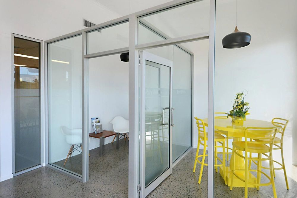 A Room with A Table and Chairs in It — North Queensland Glass & Glazing In Cannonvale, QLD
