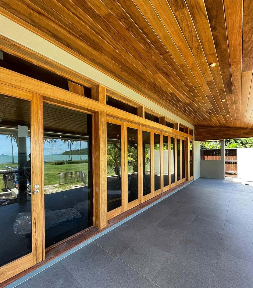 A House with A Lot of Windows and A Wooden Ceiling — North Queensland Glass & Glazing In Airlie Beach, QLD
