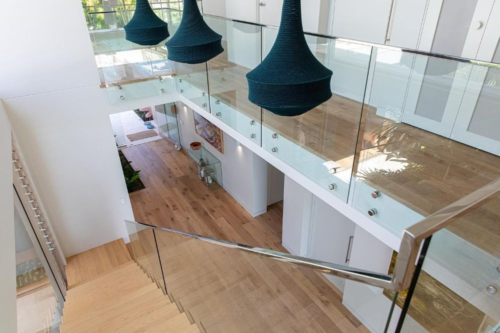 A View of A Staircase from The Second Floor of A House — North Queensland Glass & Glazing In Cannonvale, QLD
