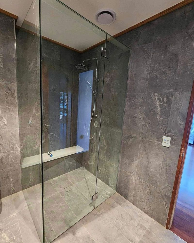 A Bathroom with A Walk in Shower and A Shower Head — North Queensland Glass & Glazing In Cannonvale, QLD