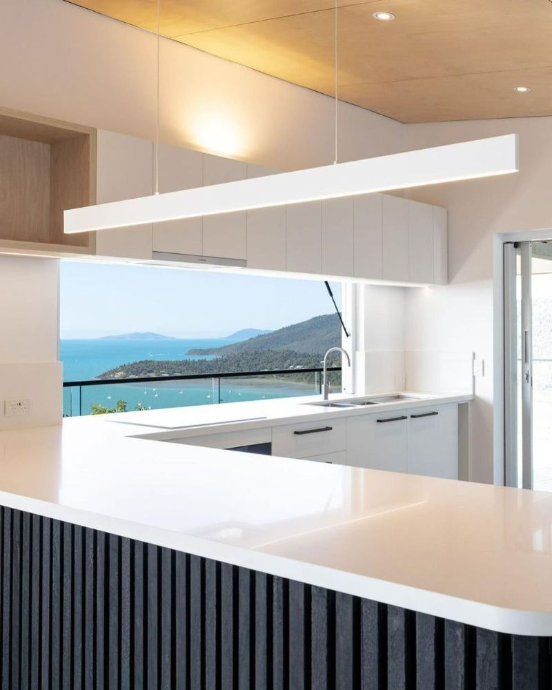 A Kitchen with A View of The Ocean and Mountains — North Queensland Glass & Glazing In Hamilton Island, QLD