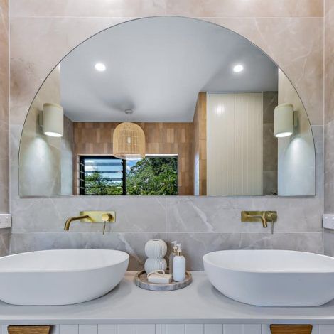 A Bathroom with Two Sinks and A Large Mirror — North Queensland Glass & Glazing In Cannonvale, QLD