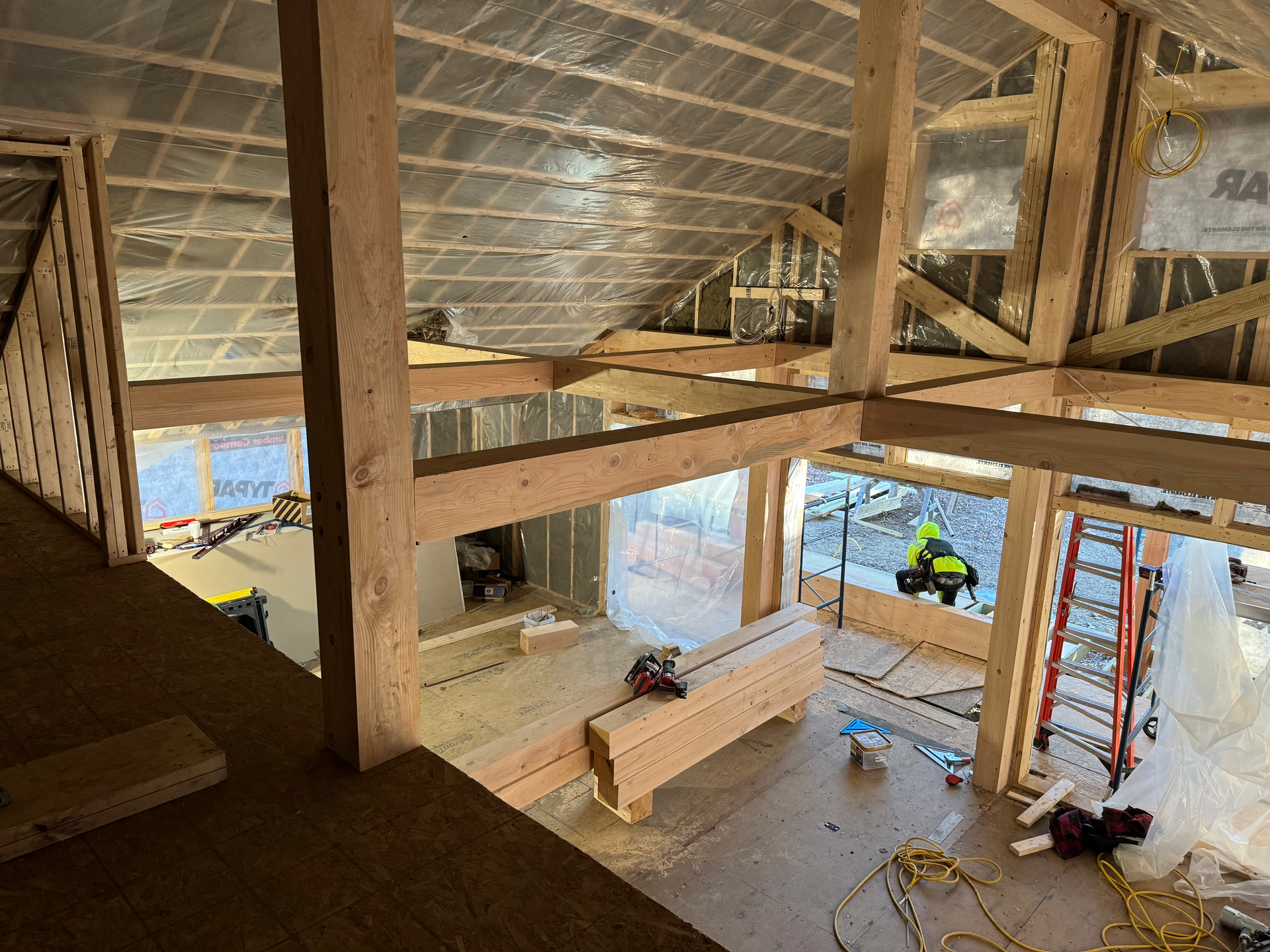 a post and beam timber frame house is under construction