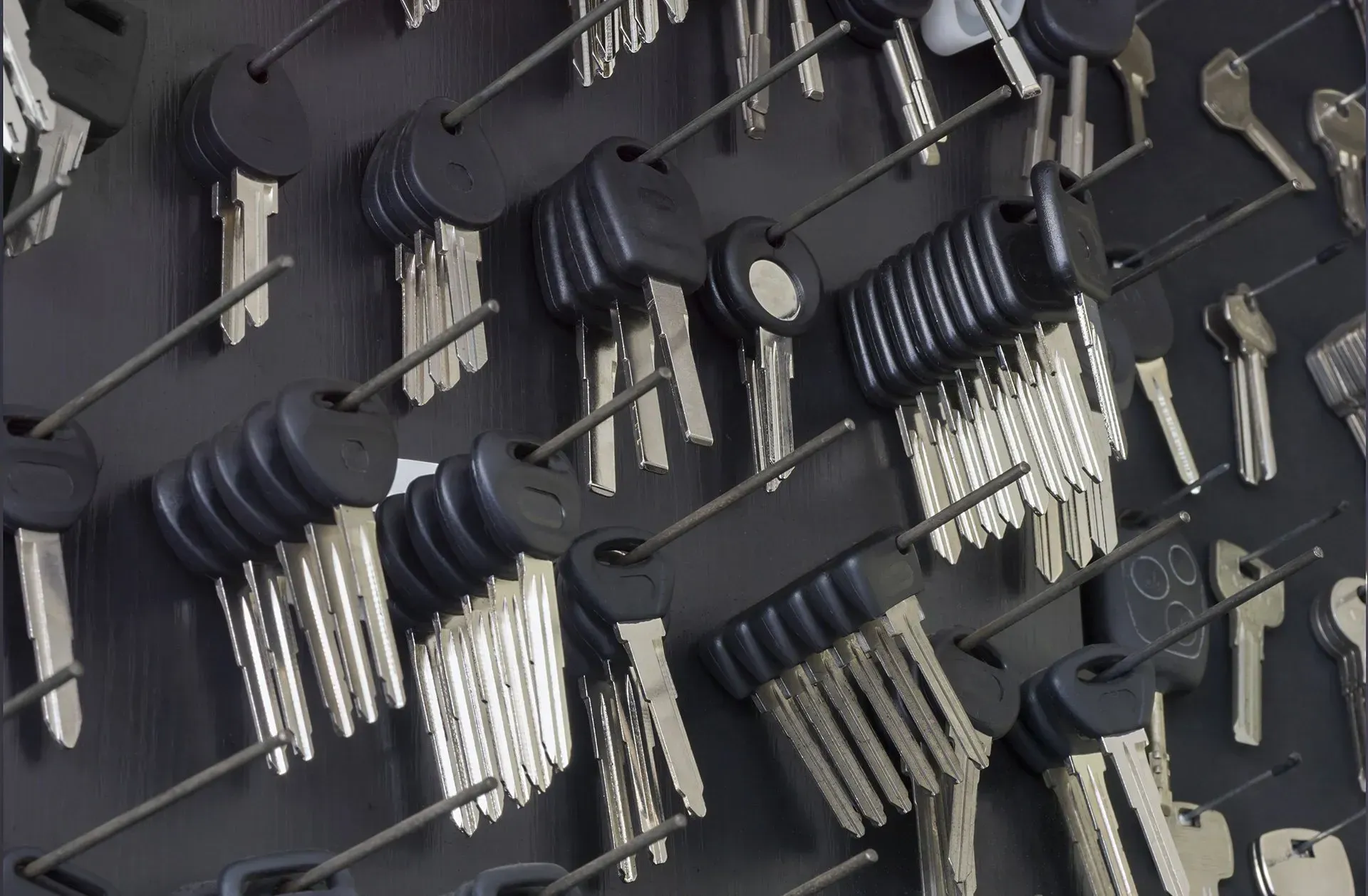 A Bunch of Keys Are Hanging on A Wall — Earthmoving Rentals Pty Ltd in Yatala, QLD