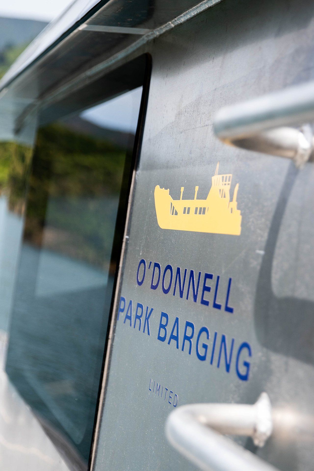 Barge with logo for O'Donnell Park Barging Ltd in Picton NZ