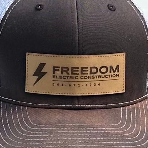 Freedom Electric Construction - A hat that says freedom electric construction on it