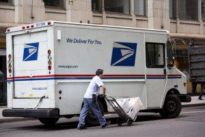Mailman outside of USPS truck