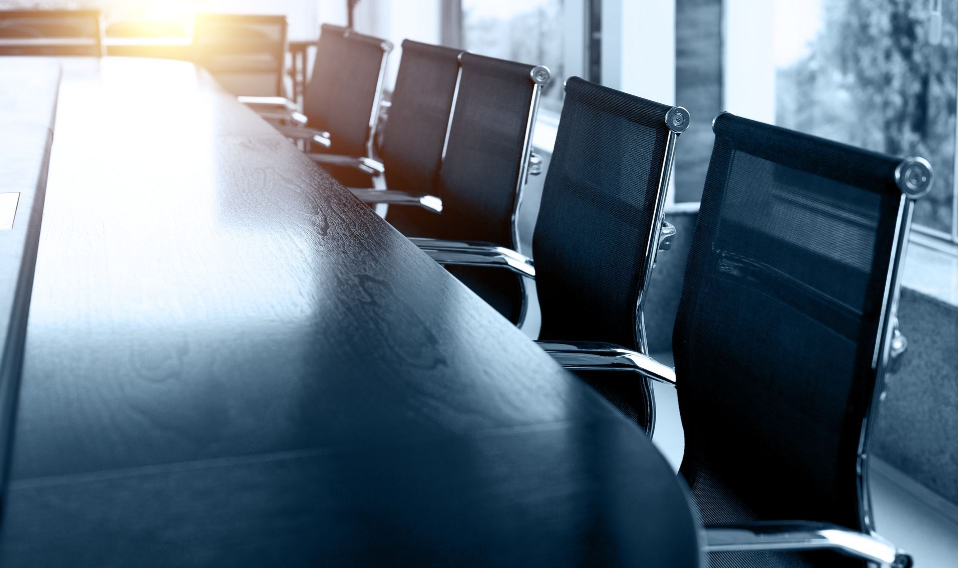 chairs around a board room table