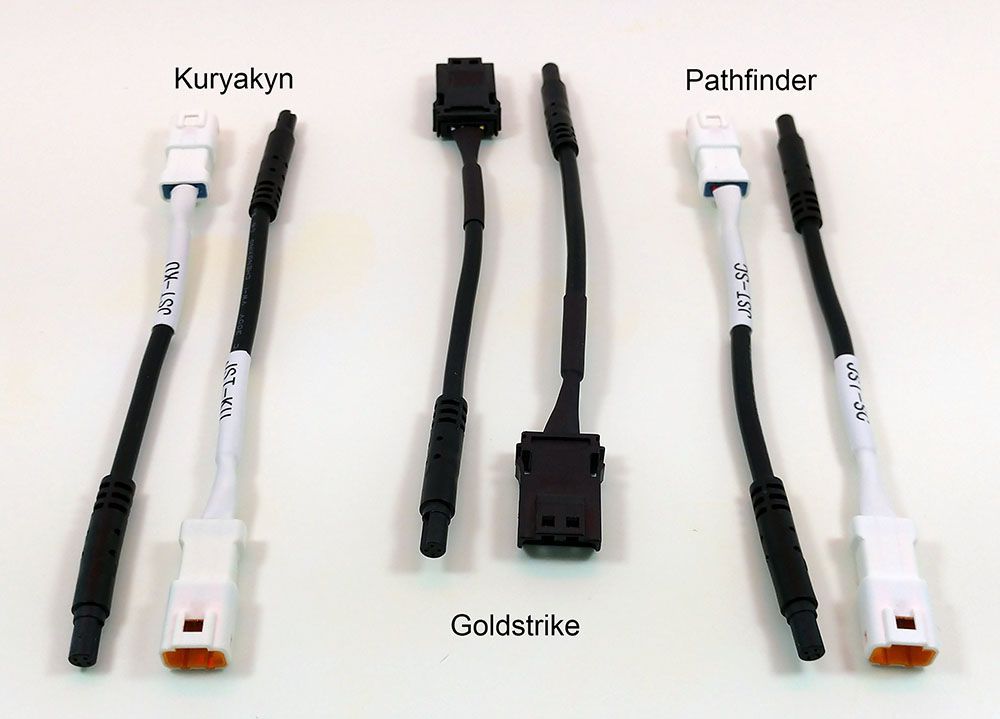 Three different brands of motorcycle light wiring harnesses
